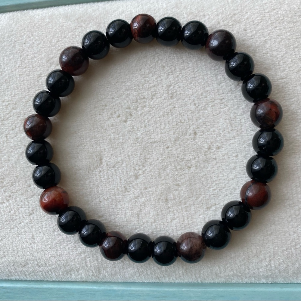 sold Black onyx and red tigers eye stretch bracelet